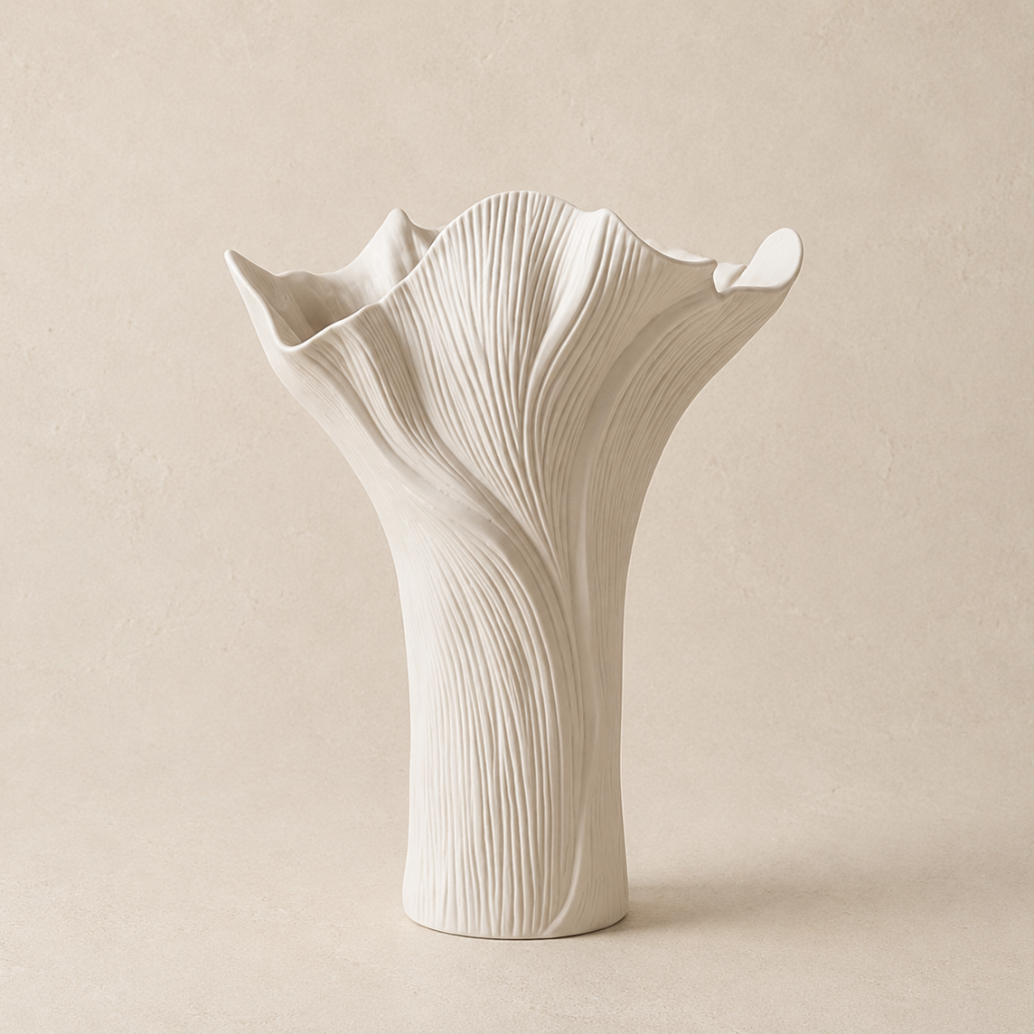 White ceramic vase with textured design on a beige background
